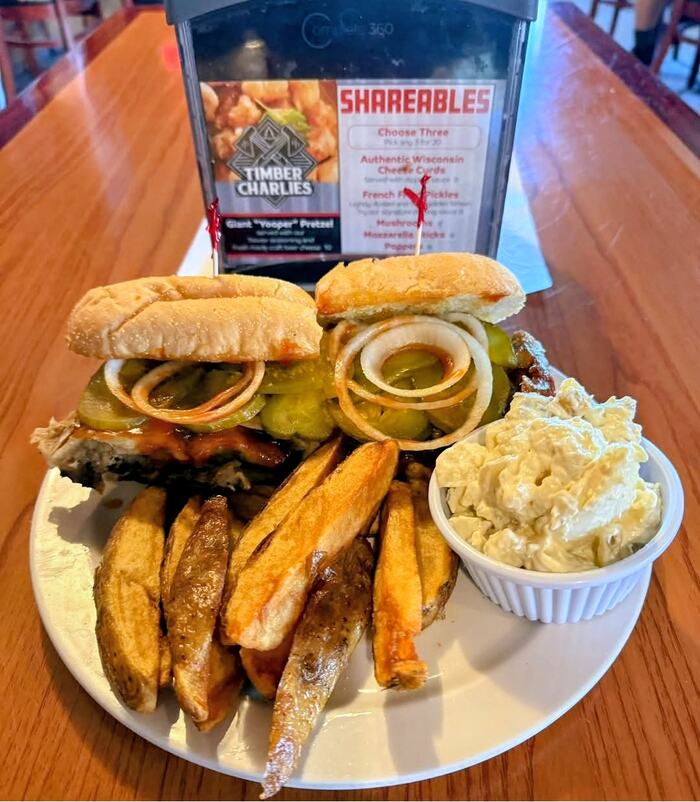 BBQ Rib Sandwich with onions & Pickles, steak fries & potato salad at Timber Charlie's Food & Spirits